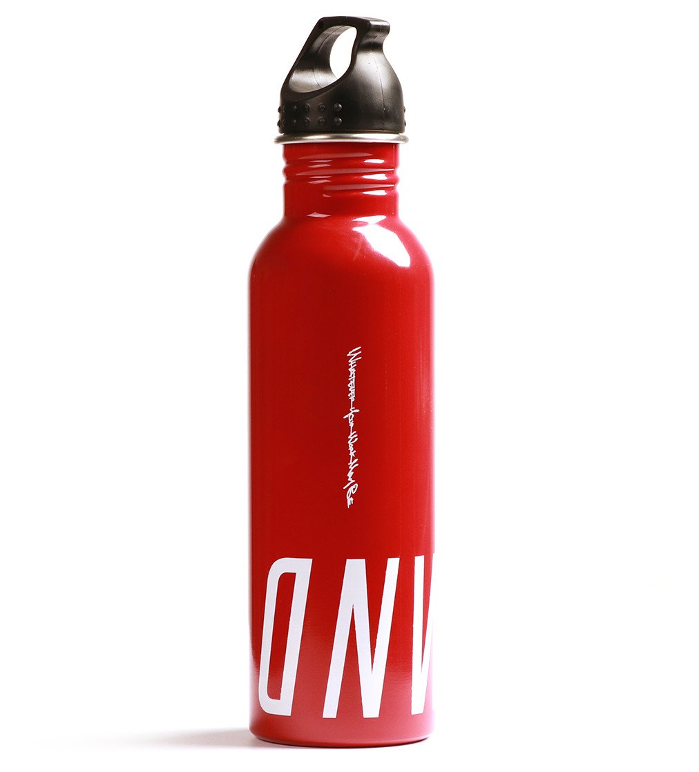 Photo of a red metal bottle with white lettering. Onward is printed on the bottom of the canister. White lettering "Whatever Your Work May Be" printed across the length of the bottle.